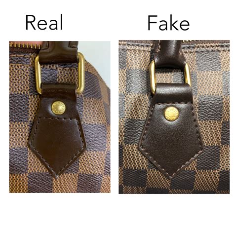 how to spot a fake louis vuitton bag charm|authentic louis vuitton duffle bag.